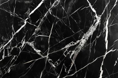 Siyah mutfak mermeri desenli beyaz damarlı bir fotoğraf. Arkaplan veya haritalama için arkaplan dokusu
