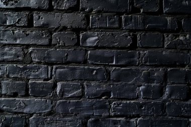 Eski tuğla duvarın resmi siyah renge boyanmış. Yakın plan. Arkaplan veya haritalama için arkaplan dokusu