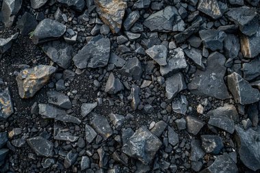 Gri asfalt kaya döküntülerinin fotoğrafı. Arkaplan veya haritalama için arkaplan dokusu