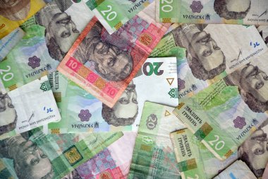 Ukrayna 'nın işlenmiş Hryvnia UAH kolajı banknotların dokusunu destekler. Pankart, arkaplan veya 3B haritalama için doku