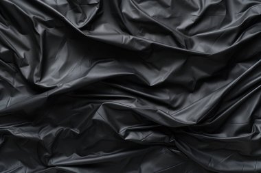 Siyah selofan çöp torbası dokusunun işlenmiş kolajı. Pankart, arkaplan veya 3B haritalama için doku