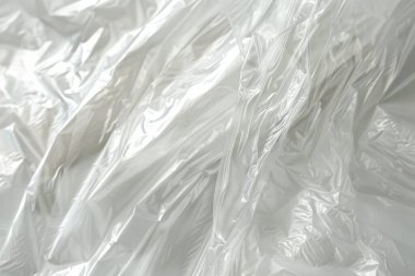 Buruşmuş politen plastik ambalaj kağıdının fotoğrafı. Arkaplan veya haritalama için arkaplan dokusu