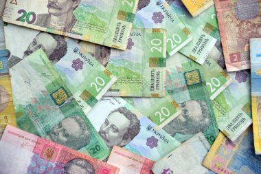 Ukrayna 'nın işlenmiş Hryvnia UAH kolajı banknotların dokusunu destekler. Pankart, arkaplan veya 3B haritalama için doku