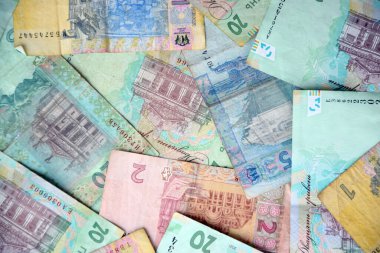 Ukrayna 'nın işlenmiş Hryvnia UAH kolajı banknotların dokusunu destekler. Pankart, arkaplan veya 3B haritalama için doku