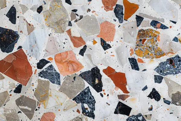 Zemin yüzeyindeki gri terrazzo parçacıklarının fotoğrafı. Arkaplan veya haritalama için arkaplan dokusu