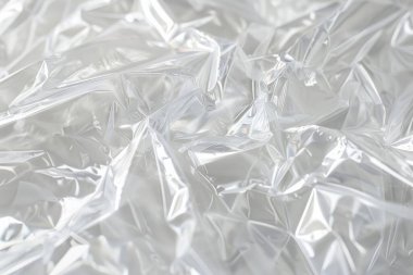 Buruşmuş politen plastik ambalaj kağıdının fotoğrafı. Arkaplan veya haritalama için arkaplan dokusu