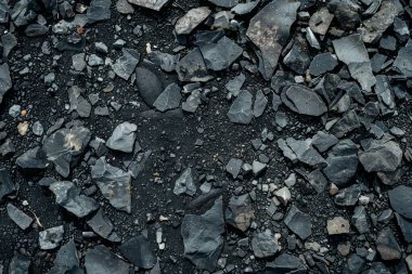 Gri asfalt kaya döküntülerinin fotoğrafı. Arkaplan veya haritalama için arkaplan dokusu