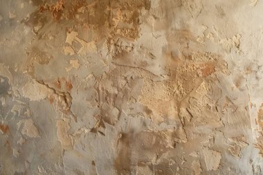 Eski çatlamış turuncu alçı duvarın fotoğrafı. Arkaplan veya haritalama için arkaplan dokusu