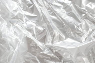 Buruşmuş politen plastik ambalaj kağıdının fotoğrafı. Arkaplan veya haritalama için arkaplan dokusu