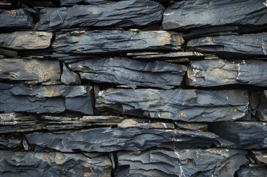  Eski gri, uzun taş duvarın fotoğrafı. Yaklaş. Arkaplan veya haritalama için arkaplan dokusu