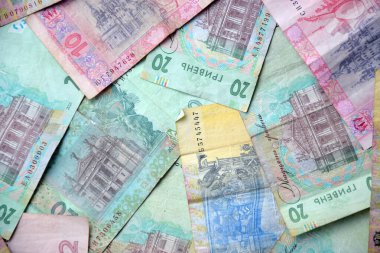 Ukrayna 'nın işlenmiş Hryvnia UAH kolajı banknotların dokusunu destekler. Pankart, arkaplan veya 3B haritalama için doku