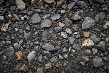 Gri asfalt kaya döküntülerinin fotoğrafı. Arkaplan veya haritalama için arkaplan dokusu