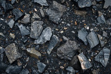 Gri asfalt kaya döküntülerinin fotoğrafı. Arkaplan veya haritalama için arkaplan dokusu