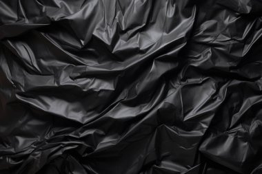 Siyah selofan çöp torbası dokusunun işlenmiş kolajı. Pankart, arkaplan veya 3B haritalama için doku