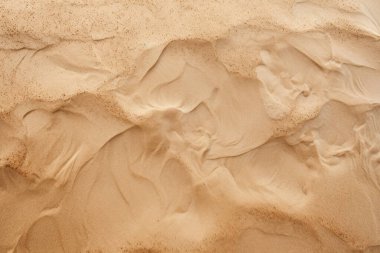 Deniz kıyısı kumlarının işlenmiş kolajı yüzey dokusu. Pankart, arkaplan veya 3B haritalama için doku