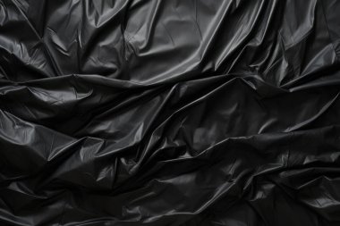 Siyah selofan çöp torbası dokusunun işlenmiş kolajı. Pankart, arkaplan veya 3B haritalama için doku