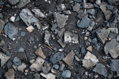 Gri asfalt kaya döküntülerinin fotoğrafı. Arkaplan veya haritalama için arkaplan dokusu