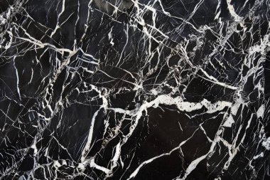 Siyah mutfak mermeri desenli beyaz damarlı bir fotoğraf. Arkaplan veya haritalama için arkaplan dokusu