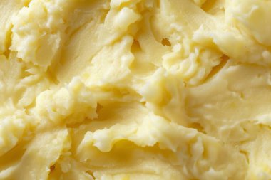 Sarı patates püre desenli fotoğraf yakın çekim. Arkaplan ya da yemek tarifleri için yemek fotoğrafı