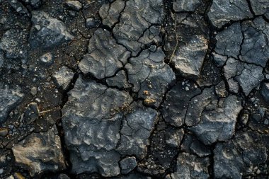 Yakından taşlı asfalt gri yüzey fotoğrafı. Arkaplan veya haritalama için arkaplan dokusu