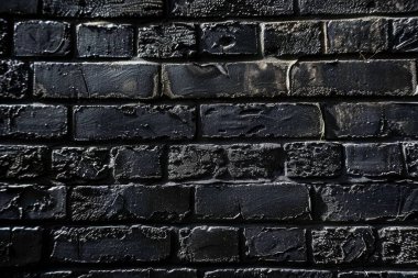 Eski tuğla duvarın resmi siyah renge boyanmış. Yakın plan. Arkaplan veya haritalama için arkaplan dokusu