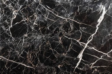 Siyah mutfak mermeri desenli beyaz damarlı bir fotoğraf. Arkaplan veya haritalama için arkaplan dokusu