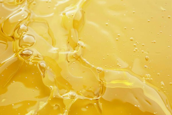 Photo of Natural resource sunflower oil substance texture close up. Food photo for backdrops or recipes