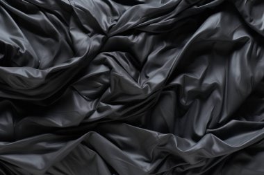 Siyah selofan çöp torbası dokusunun işlenmiş kolajı. Pankart, arkaplan veya 3B haritalama için doku