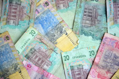 Ukrayna 'nın işlenmiş Hryvnia UAH kolajı banknotların dokusunu destekler. Pankart, arkaplan veya 3B haritalama için doku