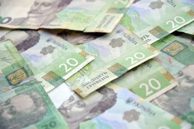 Ukrayna 'nın işlenmiş Hryvnia UAH kolajı banknotların dokusunu destekler. Pankart, arkaplan veya 3B haritalama için doku