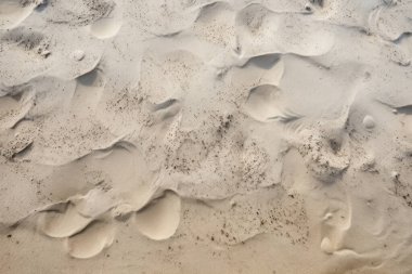 Deniz kıyısı kumlarının işlenmiş kolajı yüzey dokusu. Pankart, arkaplan veya 3B haritalama için doku