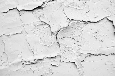 Kabuğu soyulmuş beyaz alçı duvarın fotoğrafı. Arkaplan veya haritalama için arkaplan dokusu