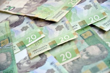 Ukrayna 'nın işlenmiş Hryvnia UAH kolajı banknotların dokusunu destekler. Pankart, arkaplan veya 3B haritalama için doku