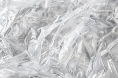 Buruşmuş politen plastik ambalaj kağıdının fotoğrafı. Arkaplan veya haritalama için arkaplan dokusu