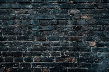 Eski getto siyah tuğla duvarının fotoğrafı. Arkaplan veya haritalama için arkaplan dokusu