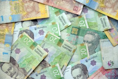 Ukrayna 'nın işlenmiş Hryvnia UAH kolajı banknotların dokusunu destekler. Pankart, arkaplan veya 3B haritalama için doku