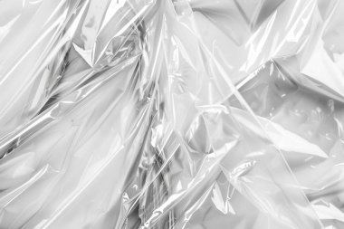 Buruşmuş politen plastik ambalaj kağıdının fotoğrafı. Arkaplan veya haritalama için arkaplan dokusu