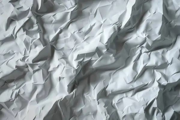 Buruşuk beyaz kağıtların fotoğrafı. Kapatın. Arkaplan veya haritalama için arkaplan dokusu