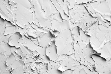 Kabuğu soyulmuş beyaz alçı duvarın fotoğrafı. Arkaplan veya haritalama için arkaplan dokusu