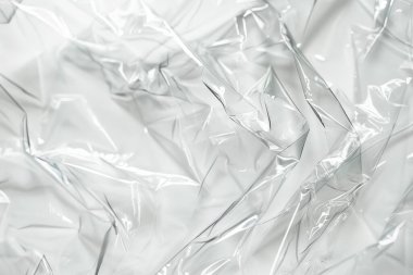 Buruşmuş politen plastik ambalaj kağıdının fotoğrafı. Arkaplan veya haritalama için arkaplan dokusu