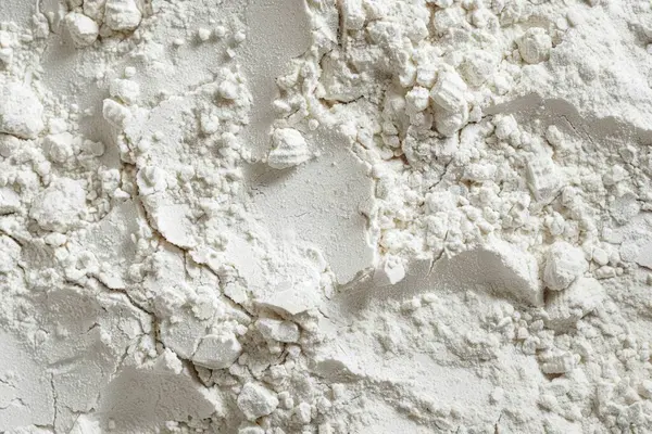 Beyaz ince un tozu makro dokusunun fotoğrafı. Arkaplan ya da yemek tarifleri için yemek fotoğrafı