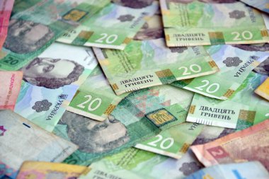 Ukrayna 'nın işlenmiş Hryvnia UAH kolajı banknotların dokusunu destekler. Pankart, arkaplan veya 3B haritalama için doku