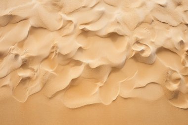 Deniz kıyısı kumlarının işlenmiş kolajı yüzey dokusu. Pankart, arkaplan veya 3B haritalama için doku