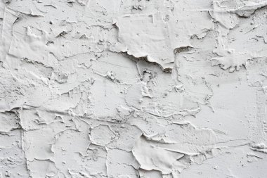 Kabuğu soyulmuş beyaz alçı duvarın fotoğrafı. Arkaplan veya haritalama için arkaplan dokusu