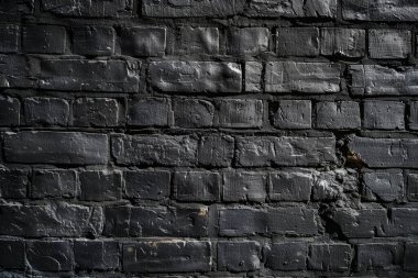 Eski tuğla duvarın resmi siyah renge boyanmış. Yakın plan. Arkaplan veya haritalama için arkaplan dokusu