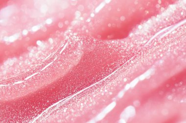 Taze dudak parlatıcısının parlak pembe renkli fotoğrafı. Arkaplan veya haritalama için arkaplan dokusu