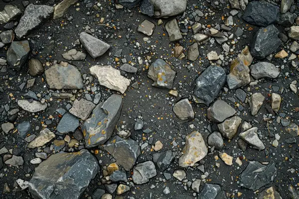 Gri asfalt kaya döküntülerinin fotoğrafı. Arkaplan veya haritalama için arkaplan dokusu