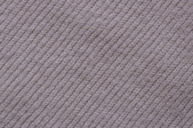 Örülmüş pastel pembe süveter dokusu, yakın çekim bej pembe örgü kumaş dokusu.