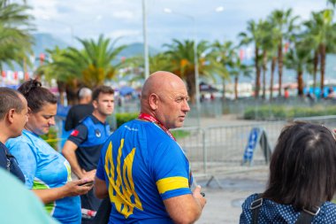Alanya, Turkey, 16.10.2022: The coach of the team from Ukraine during the race of athletes monitors the work of the athletes.
