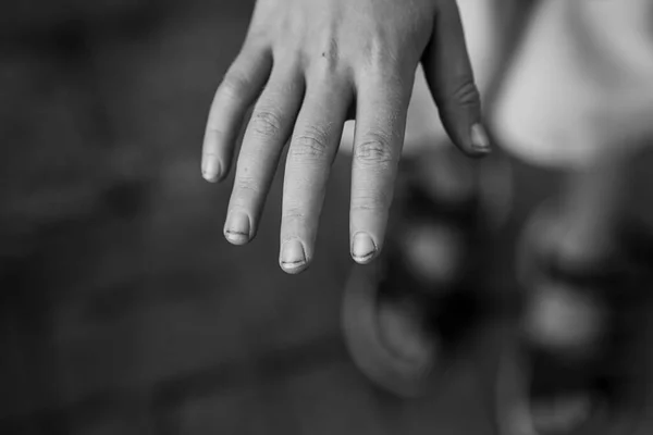 stock image Close-up photo of the boy's hands. The hands of a yard boy. Long fingernails and dirt under the nails. Untidy children's hands. Black and white image.